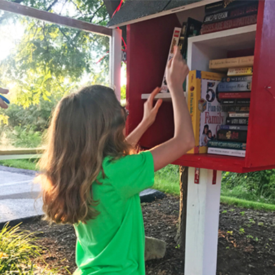 Young philanthropist opens little free library 